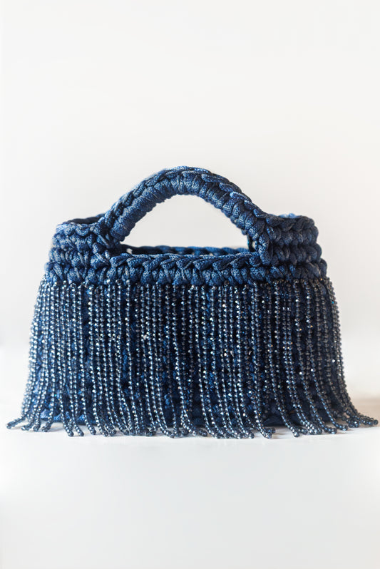 Luce blu scuro con frange lunghe